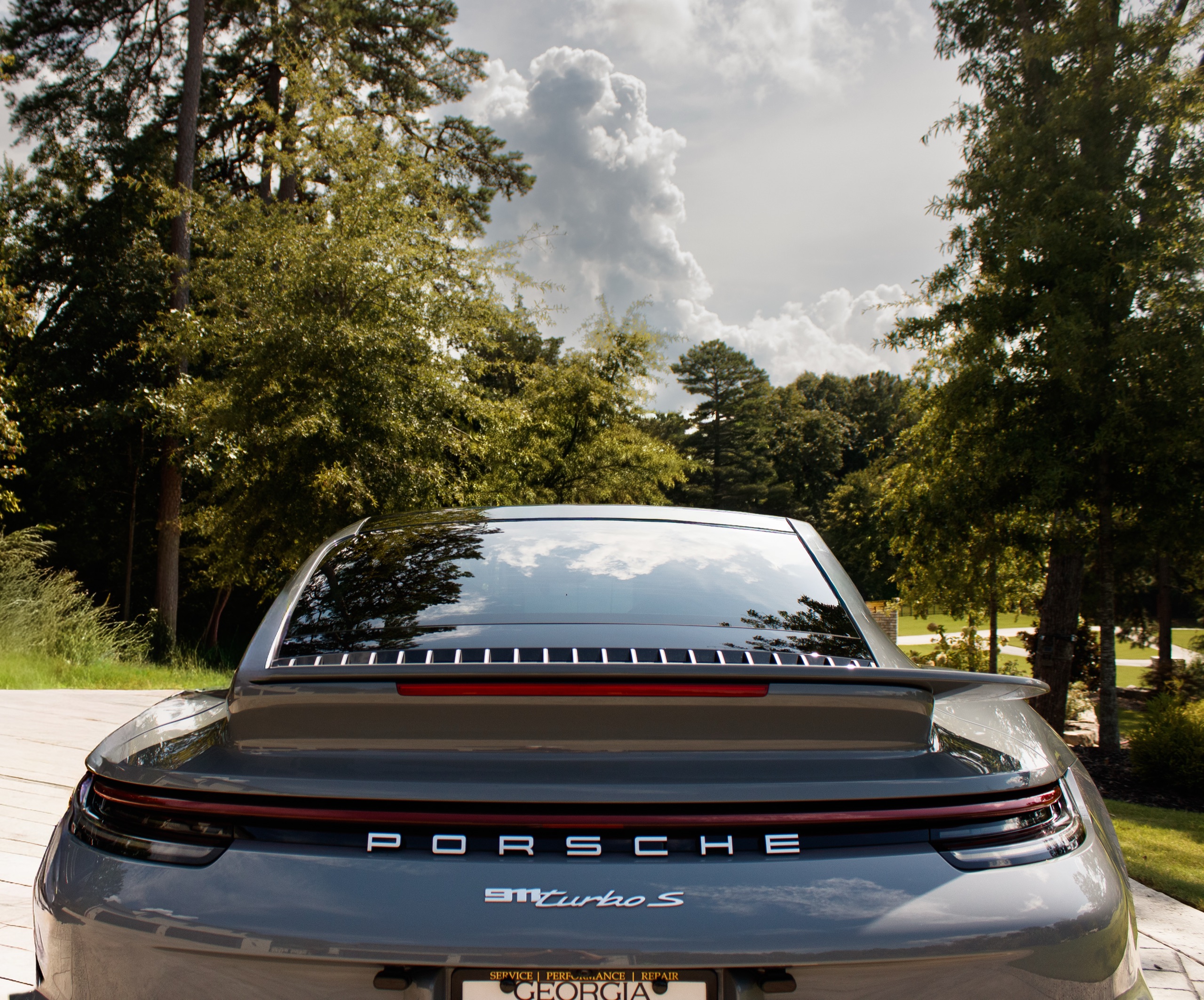 Rear finish of a detailed gray Porsche